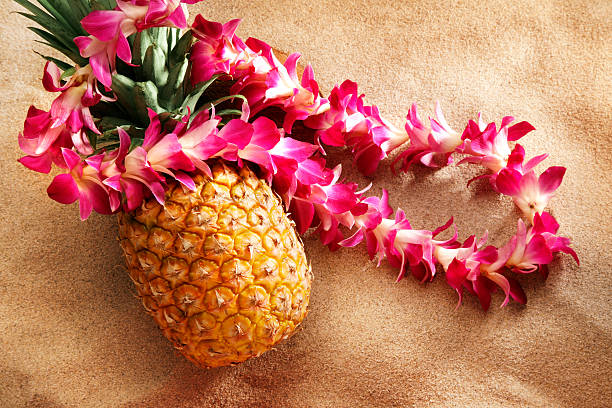 lei on pineapple at the beach